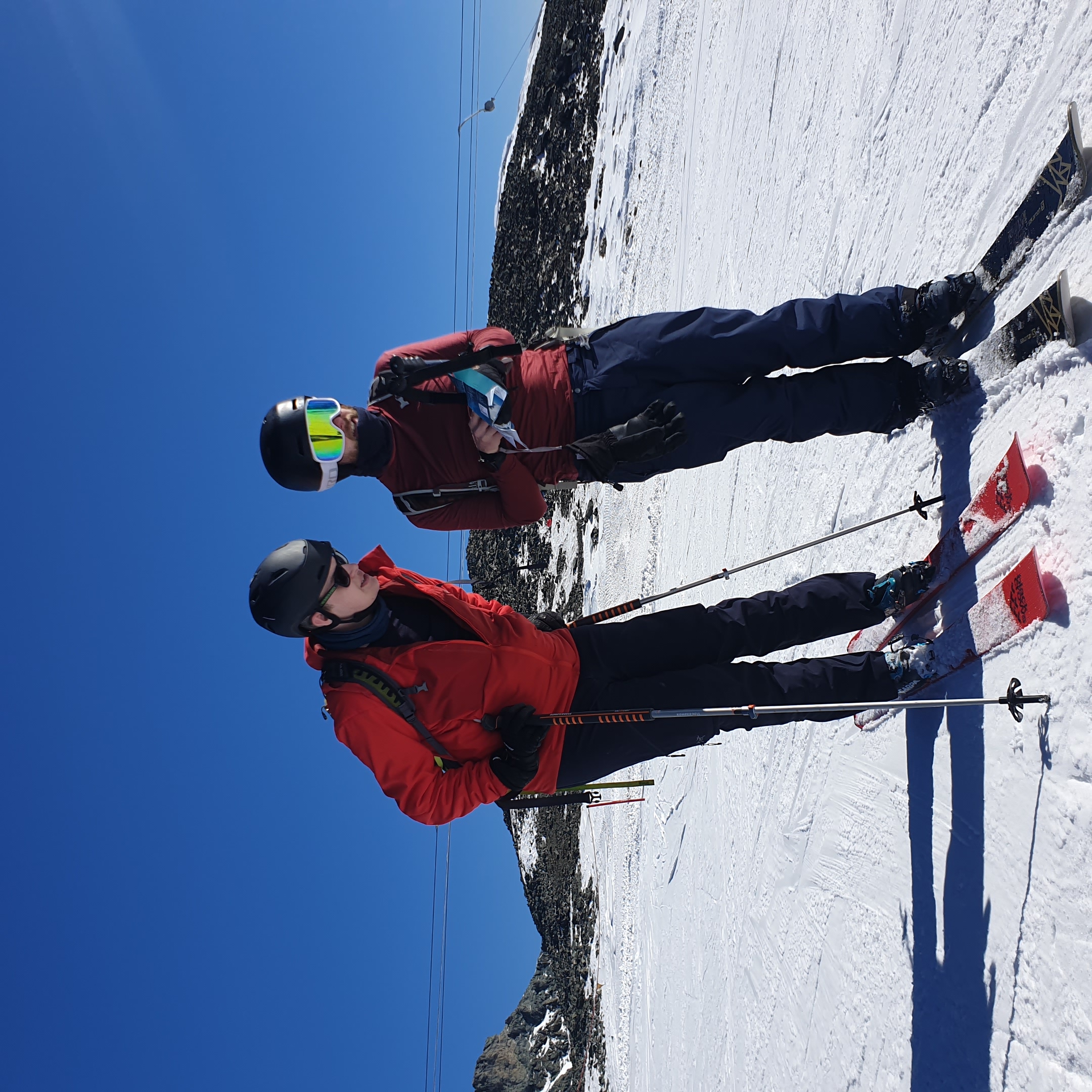 a photo of two of my work friends in ski gear, wearingskis